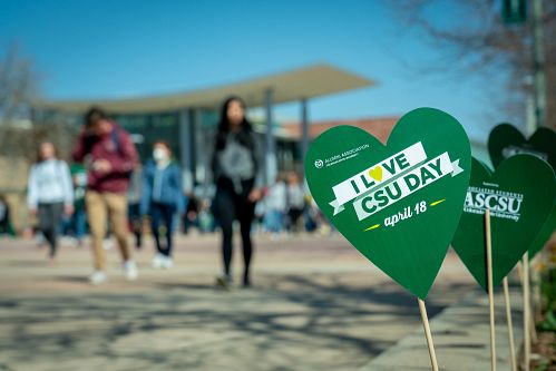 Photo on CSU's plaza focused on green heart print that says "I LOVE CSU DAY" with the Alumni Association's logo.