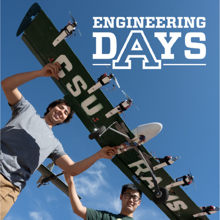Two student hold a large drone with "CSU Rams" painted on the wings. Engineering Days logo in the corner.